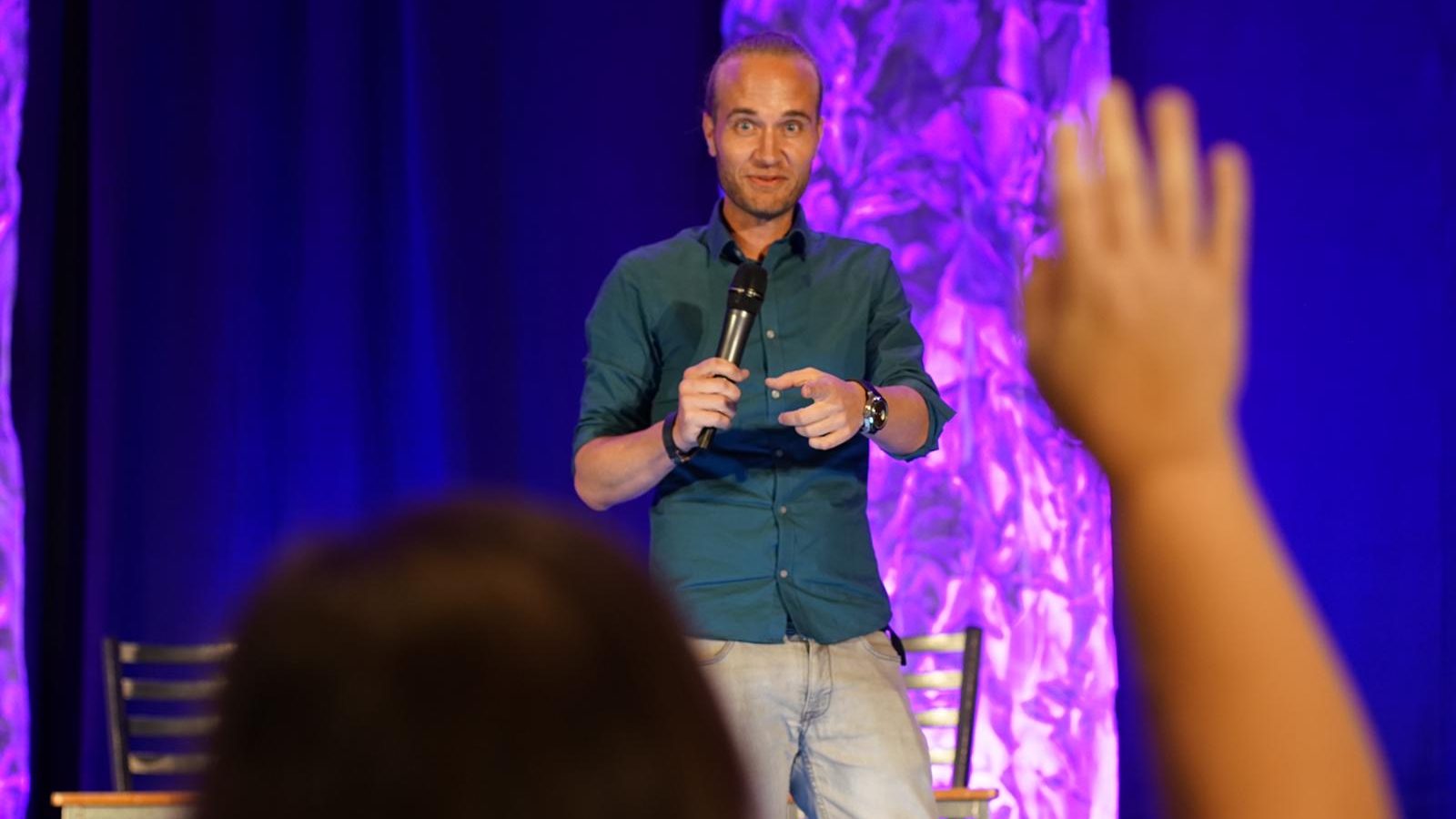 Joeri Billast on stage in New York taking a question from a member of the audience